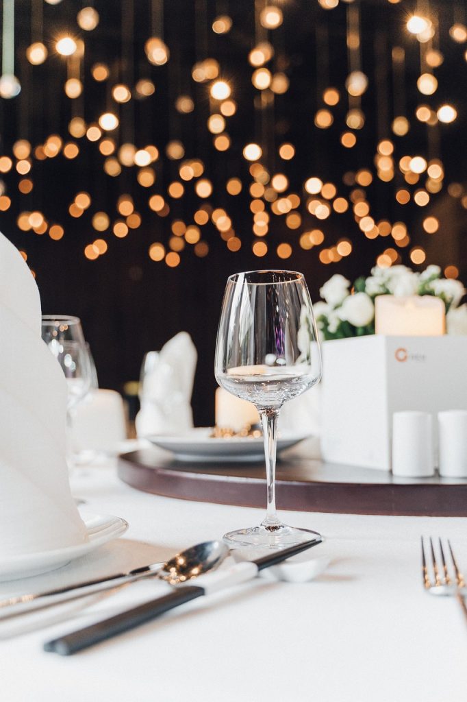 wine-glass-table-setting-party-5705718 wine glass, table setting, party, glass, cutlery, celebration, decoration, decorative, lights, wedding, bokeh, table setting, party, party, party, party, party, wedding